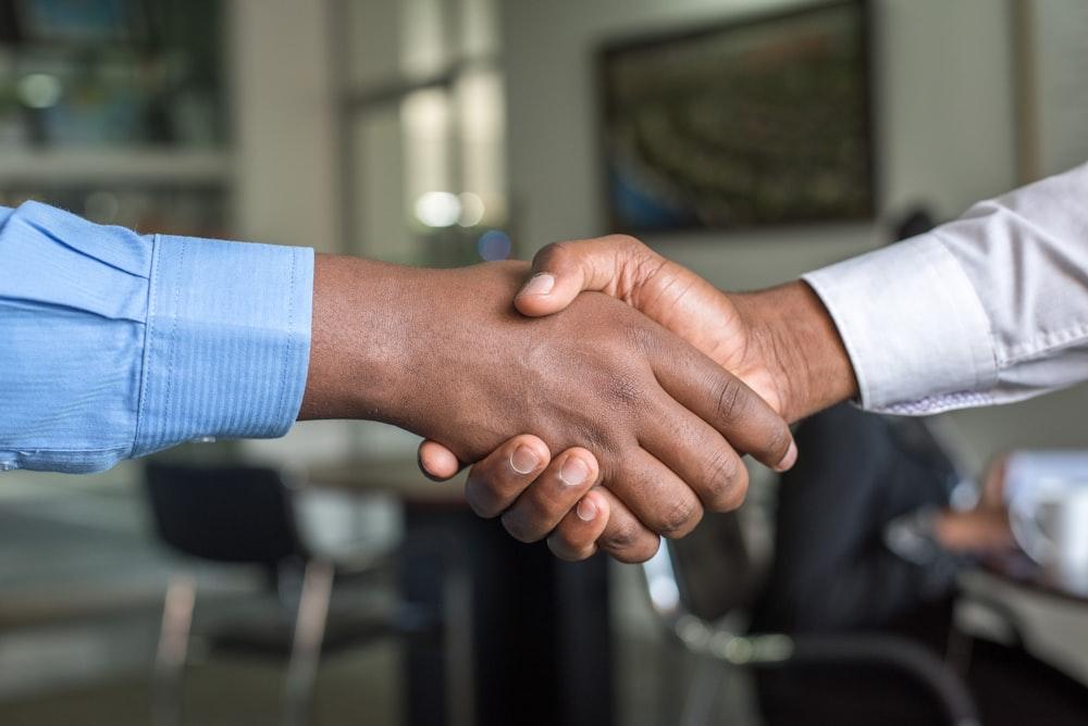 Founder and strategic advisor shaking hands